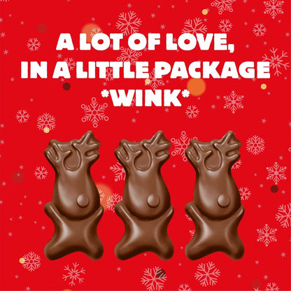 Maltesers chocolate reindeer figures on red Christmas background